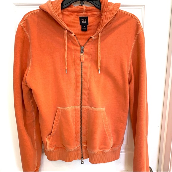 orange zip up